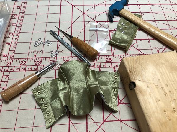 Rivet installation in a doll bustier