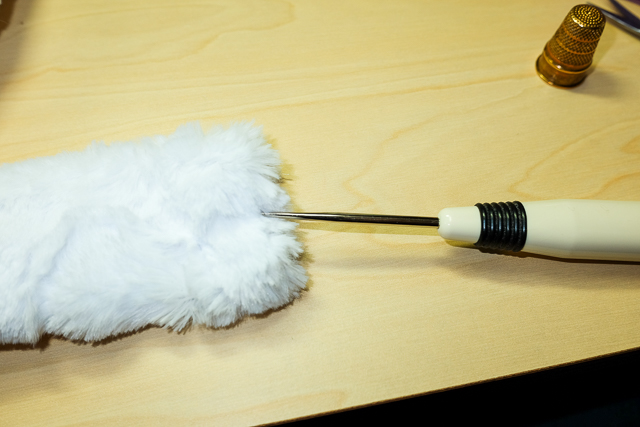 Unpicking the seam with an awl